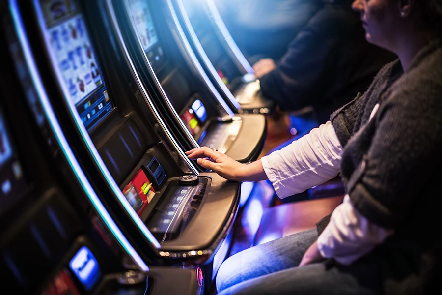 person playing a slot machine