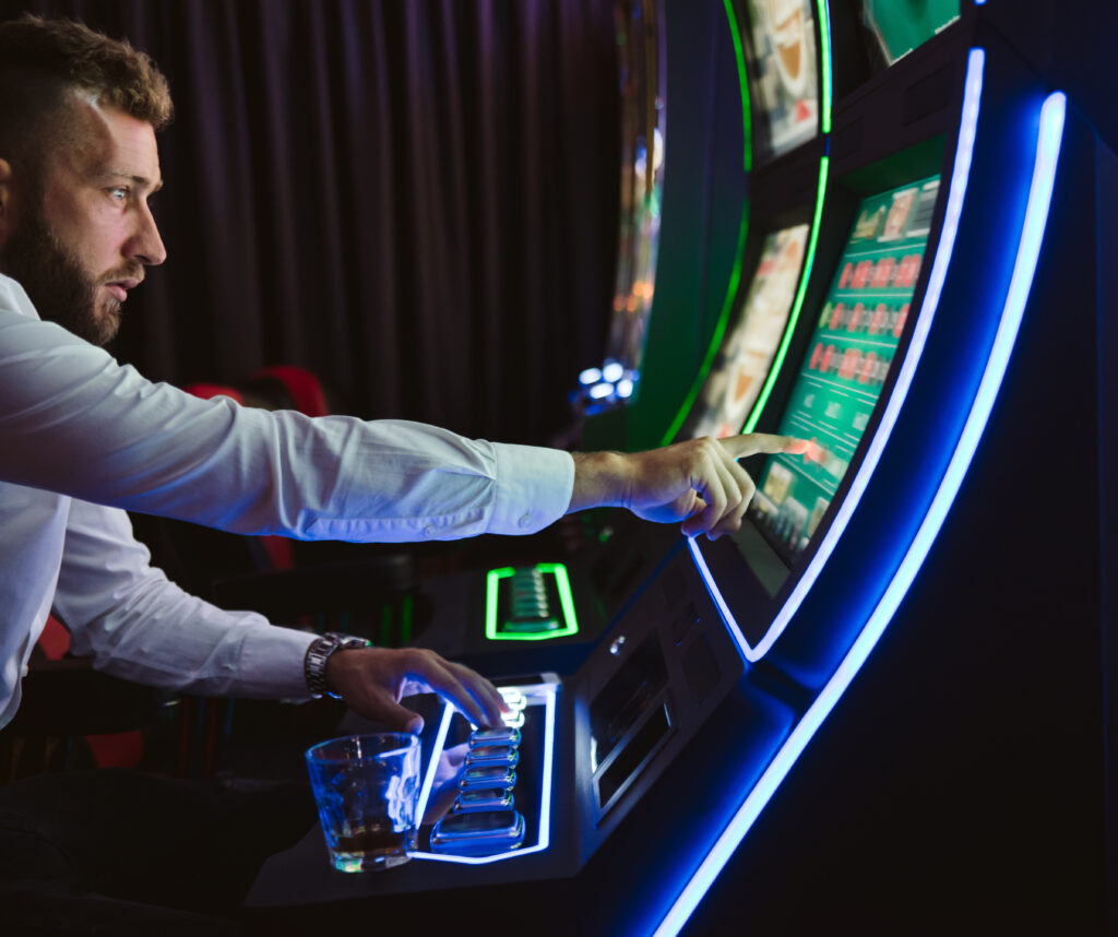 Man playing a slot machine